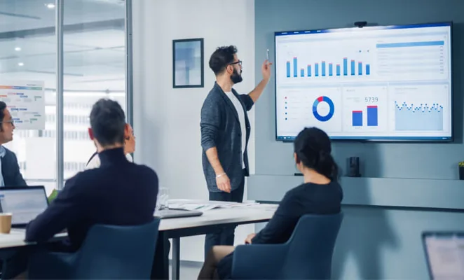 Digital signage displays showing menus and dashboards