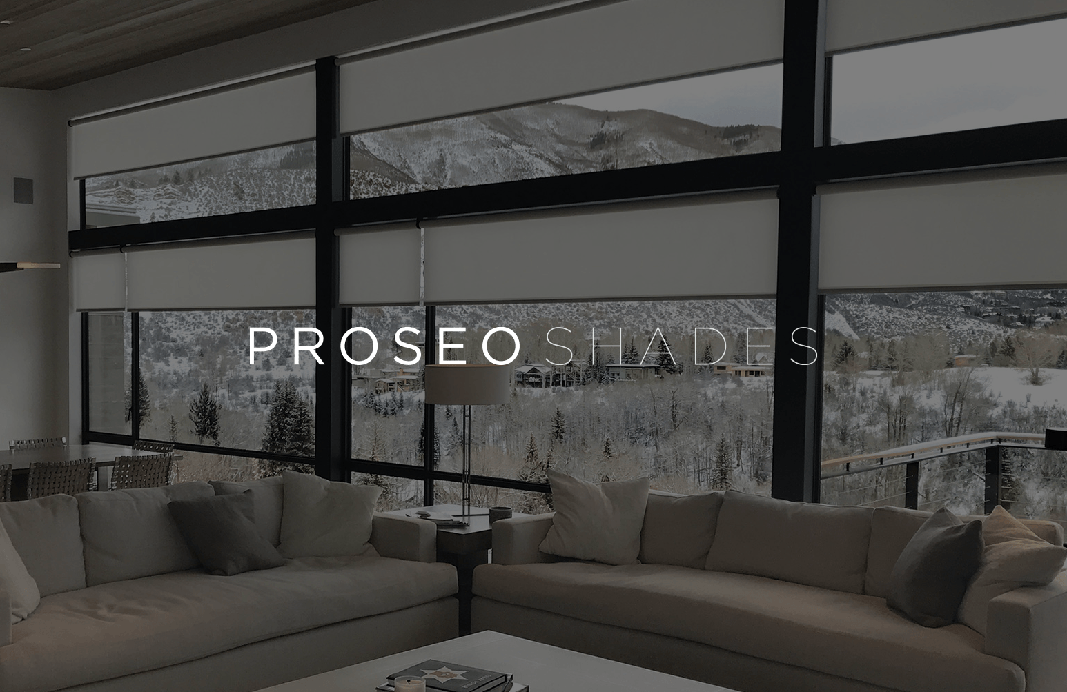 Living room with motorized shades and layered lighting