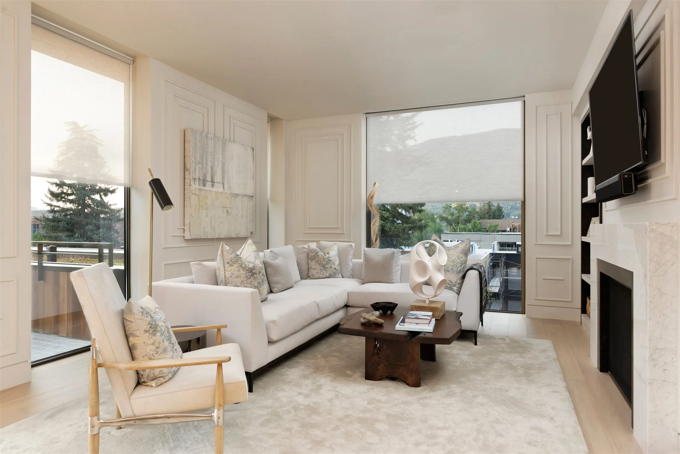 Modern living room featuring motorized shades