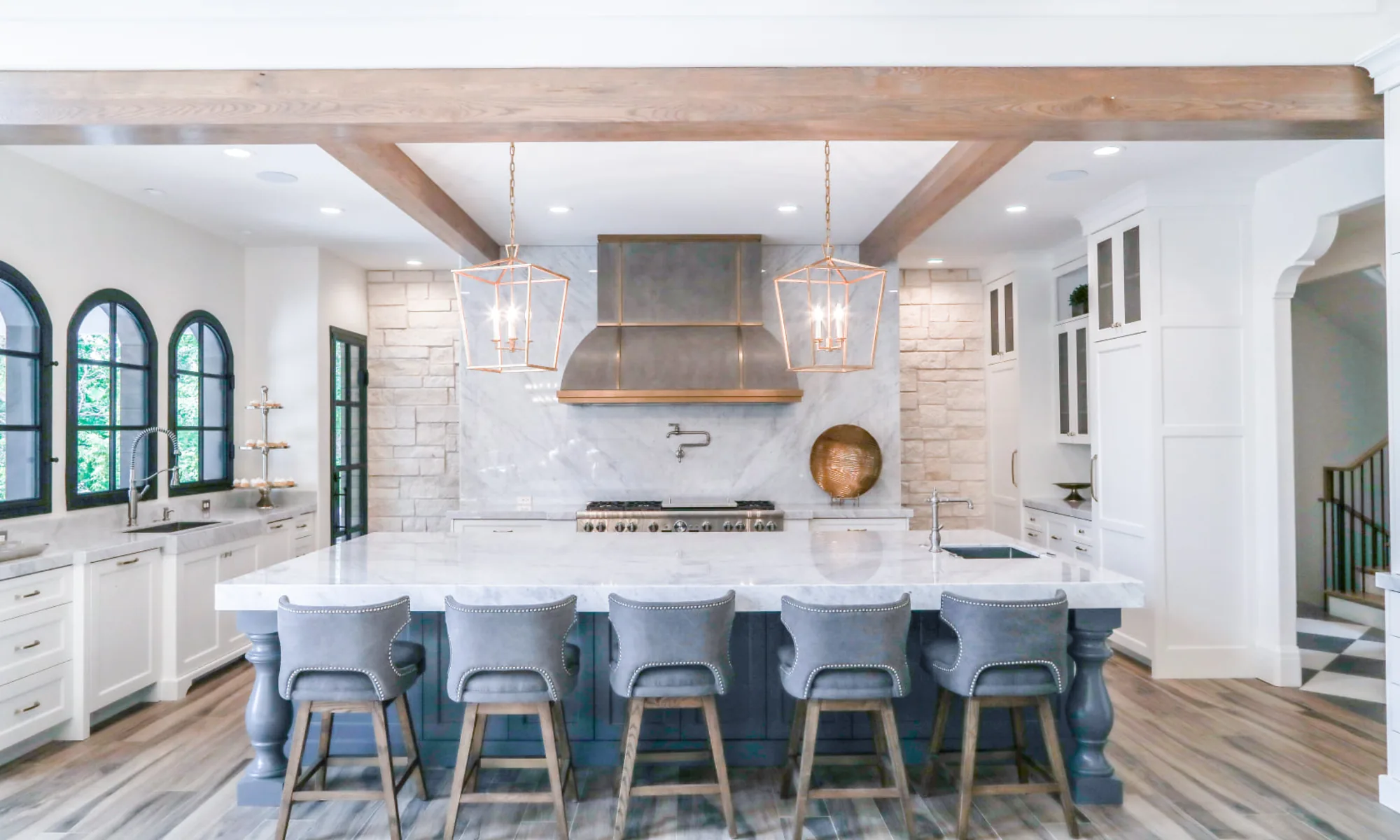 Bright modern kitchen with discreet in-ceiling speakers playing music across the home